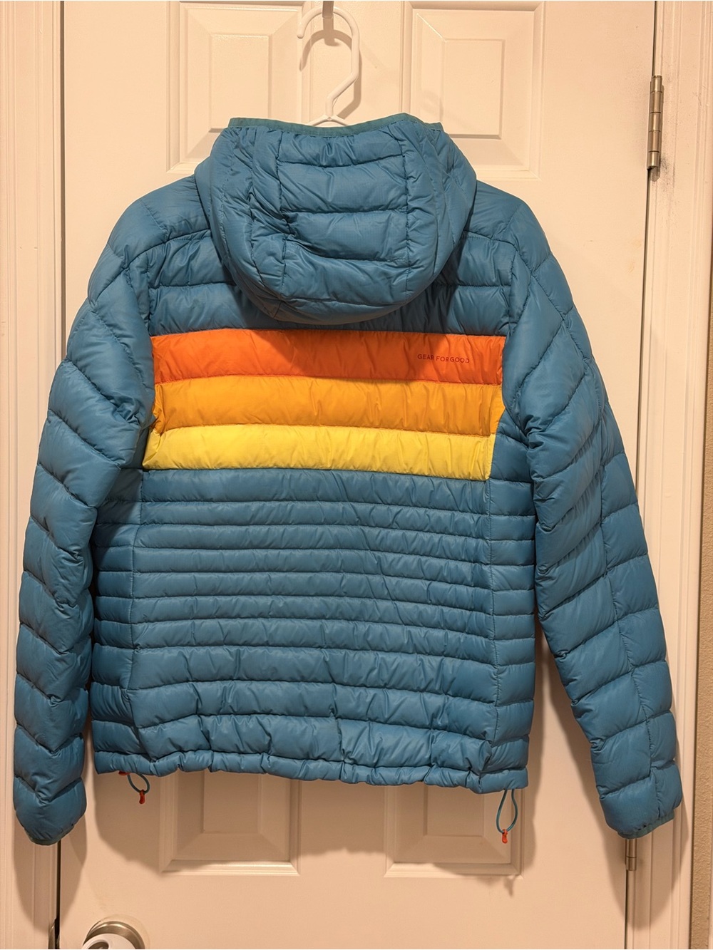 cotopaxi Blue Jacket with Orange, Yellow and Gold Sunset Stripes - Picture 2 of 2